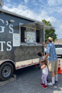 Young Roanoke customers ages 3 and 6 get introduced to Mr. G's Donuts